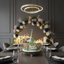 Elegant dining room setup with floral arch, table setting, and decorative lighting.
