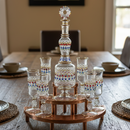 Decorative glass set on a wooden stand with 'Arabazaar' branding on a table.