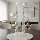 Decorative candle holders on a marble base in a living room setting
