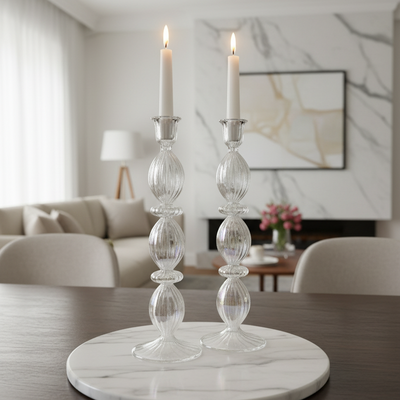 Decorative candle holders on a marble base in a living room setting