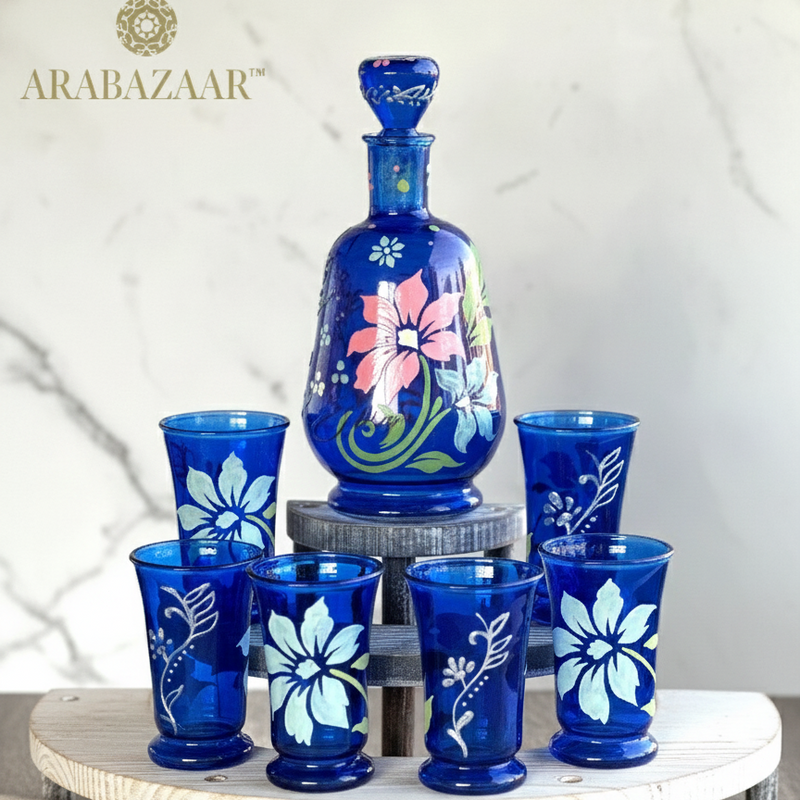 Set of blue glassware with floral designs on a white surface, featuring the Arabazaar brand.