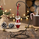 Decorative Christmas ornament on a stand with festive background